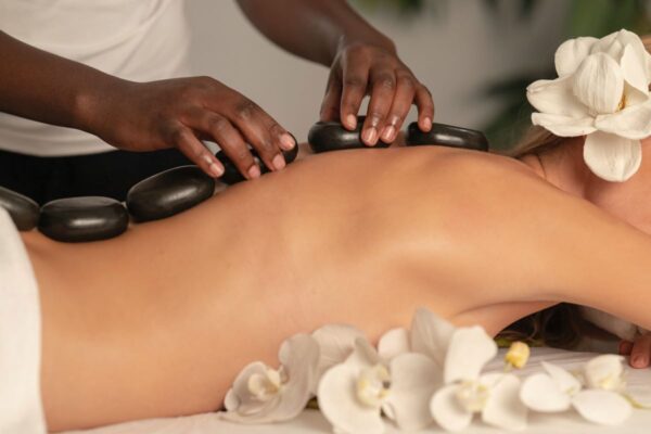 woman getting stone massage