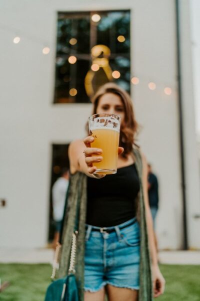 woman holding a beer